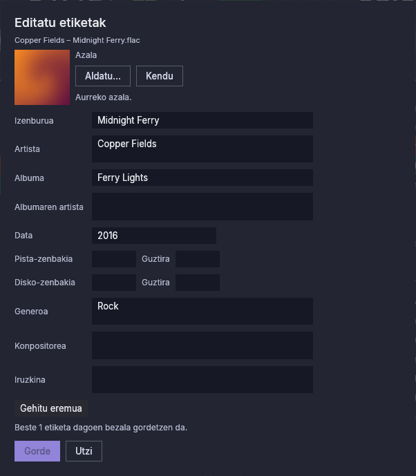 FLAC fitxategi baten etiketa-editorea, bere azala, izenburua, artista, albuma, data eta generoarekin